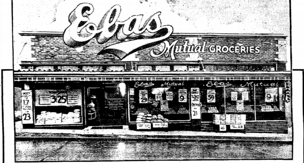 The logo for Eba's Mutual Groceries in 1936 is drawn over the front of their new Roosevelt Way store (January 31 1936 Seattle Times)
