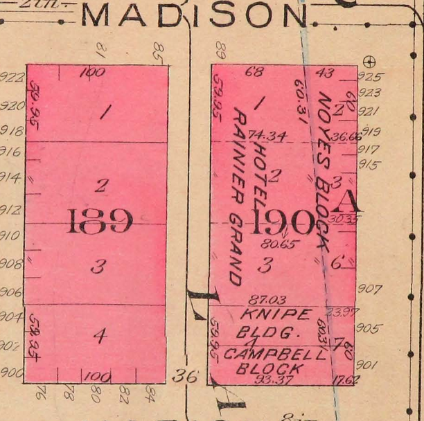 Map showing the block bound by Madison, Marion, Western, and First Avenue. All of the buildings are red, indicating brick. On the east side is labeled "Noyes Building" and "Hotel Rainier Grand".